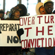 Protesters march in front of city court in New York 05 December, 2002 over five men charged with the 1989 sexual assault on a jogger in Central Park.
DOUG KANTER/AFP/Getty Images